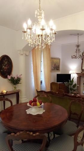a living room with a table with a bowl of fruit on it at Originari del Garda in Garda