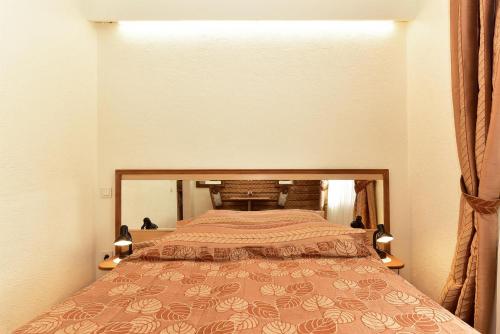 a bedroom with a bed in a room at Dalija in Druskininkai