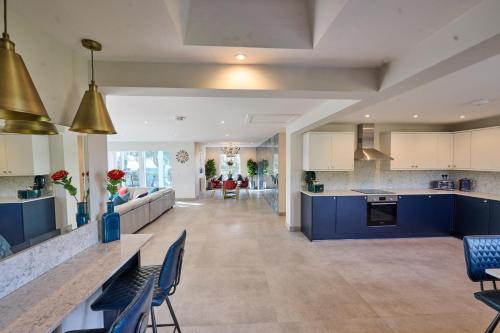 A kitchen or kitchenette at Luxurious 5-Bed House with Pool, Hot Tub & Parking