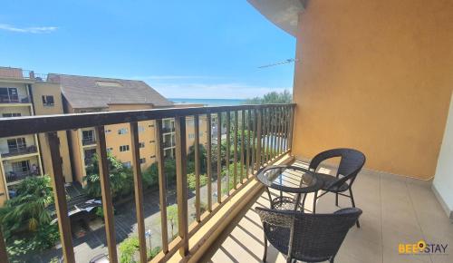 a balcony with a table and chairs and the ocean at Gold Coast Morib Studio l Apartment I Penthouse in Banting
