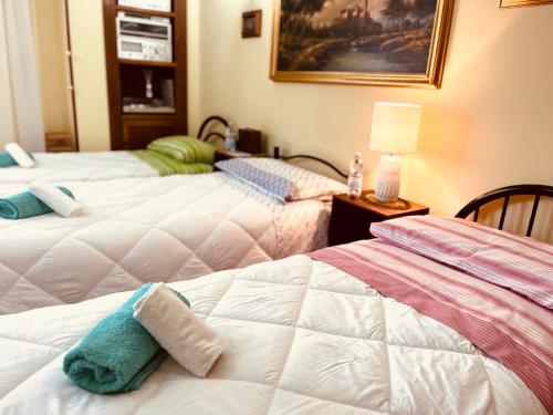 A bed or beds in a room at Affittacamere Umberto&Marisa