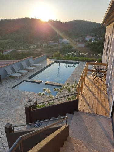 a swimming pool on the side of a building at Casa Bem Estar in Mortágua