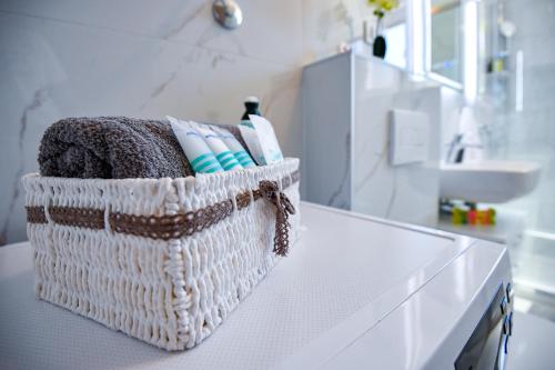 a basket sitting on top of a counter in a bathroom at The Fairy's Cave in Dubrovnik