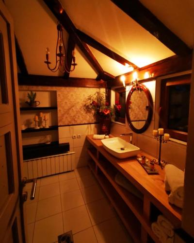 a bathroom with a sink and a mirror at Vikendica Despotovic in Bijeljina