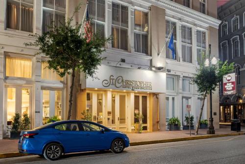 a blue car parked in front of a building at Best Western Plus St. Christopher Hotel in New Orleans