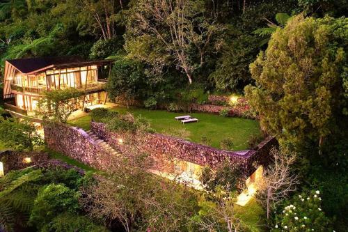 an aerial view of a house with a garden at Villa Jado 3 - Lake and Mountain View Villa in Bedugul