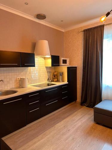 a kitchen with a sink and a counter top at PARKOVY apart in Truskavets