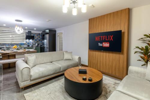 a living room with a couch and a table at Baymari Suites Design Florya in Istanbul