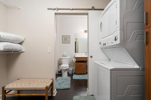 a small bathroom with a sink and a toilet at Sweet Tart Spot - Cozy TC Condo - Pet Friendly in Traverse City