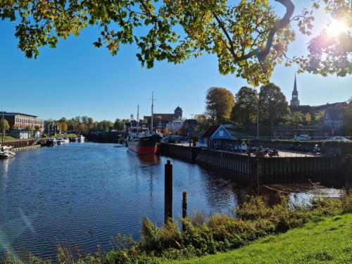 a view of a river with a boat in it at Kiek In Hotel Zur Einkehr in Stade