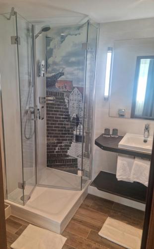 a bathroom with a shower and a sink at Kiek In Hotel Zur Einkehr in Stade