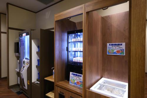 a refrigerator with its door open in a kitchen at Dormy Inn Express Fujisan Gotemba in Gotemba