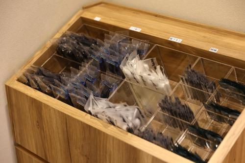 a wooden box filled with lots of different items at Dormy Inn Express Fujisan Gotemba in Gotemba