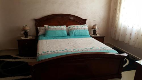 Postel nebo postele na pokoji v ubytování Residence Al Massira