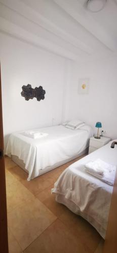 Postel nebo postele na pokoji v ubytování Geranio Chipionahome