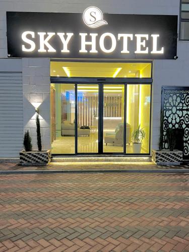 a sign for a sky hotel on the side of a building at Sky Hotel in Aqaba