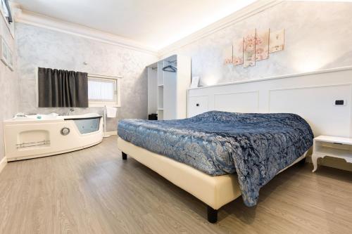 Postel nebo postele na pokoji v ubytování HOTEL Villa Lilla