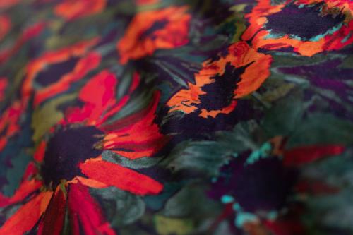 a close up of red flowers on a blanket at No11 Boutique Hotel & Brasserie in Edinburgh