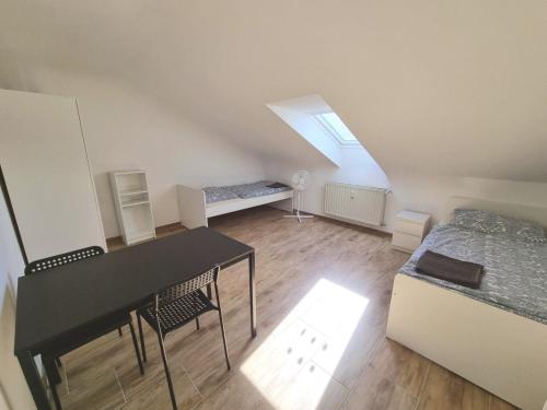 Ένα ή περισσότερα κρεβάτια σε δωμάτιο στο Boardinghouse Wendelstein