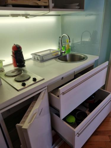 a kitchen with a sink and a counter with drawers at Welcome Senj TWIN BED ! in Senj