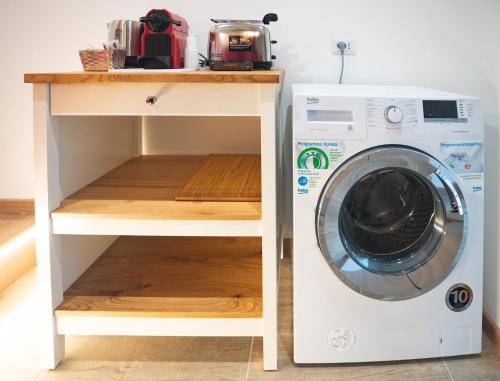 a laundry room with a washing machine and a counter at Verrazzano 37 Guest House in Rome