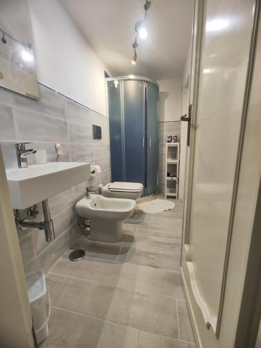 a bathroom with a toilet and a sink and a shower at Casa Eden in Atrani
