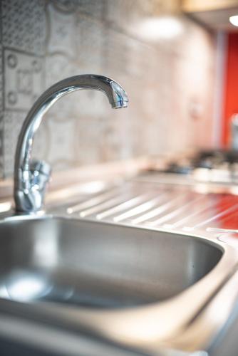 a sink in a kitchen with a faucet at Verrazzano 37 Guest House in Rome
