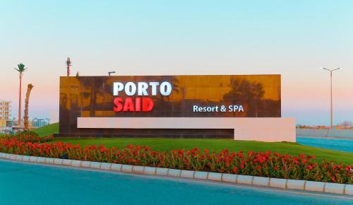 a sign for a sale at a resort at Porto Said Resort Rentals in El-Garâb`a