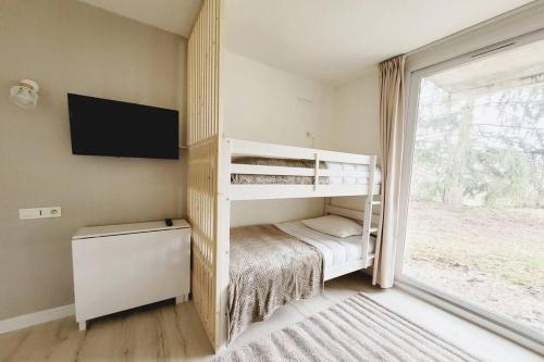 Poschodová posteľ alebo postele v izbe v ubytovaní Appartement bohème aux portes du Futuroscope