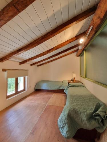 a bedroom with two beds in a room at Casa en Camino del cuadrado Sierras de Córdoba in Río Ceballos