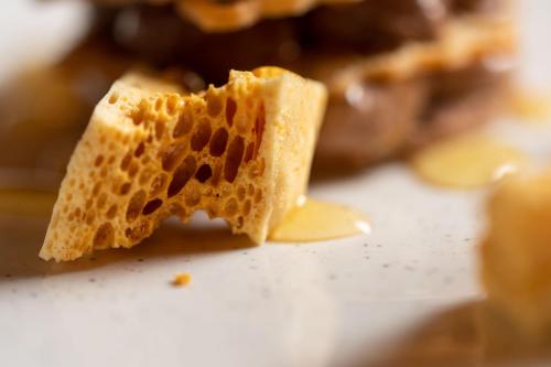 a piece of bread with a beehive on it at No11 Boutique Hotel & Brasserie in Edinburgh