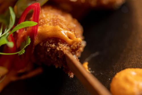 a close up of a plate of food on a table at No11 Boutique Hotel & Brasserie in Edinburgh