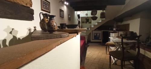 a kitchen with a counter with a vase on it at Convivio Etrusco in Bassano in Teverina