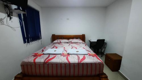Una cama o camas en una habitación de Hotel Brisas del Nare