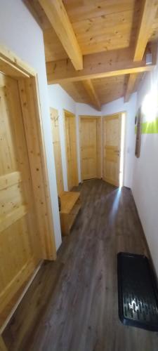 an empty room with wooden walls and wooden floors at Apartment Birgit in Uderns
