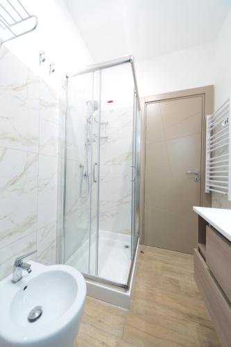 a bathroom with a shower and a sink at Slow Chic Apartment BeB Policlinico in Messina