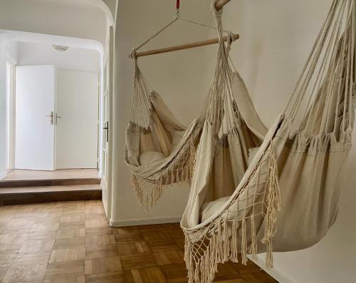 a hammock hanging from a wall in a room at Apartmán Teplice nad Metují in Teplice nad Metují