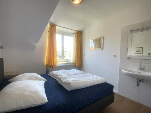 Ένα ή περισσότερα κρεβάτια σε δωμάτιο στο Sleedoornstraat 1