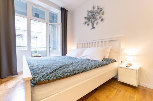 a bedroom with a bed and a window at Petra - Official 4* One Bedroom Apartment-Balcony in Zagreb