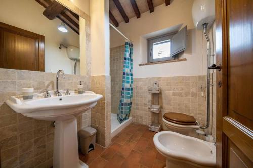 Ванна кімната в Maison Uccellina