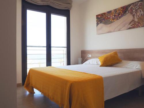 Posteľ alebo postele v izbe v ubytovaní Apartamento Univers