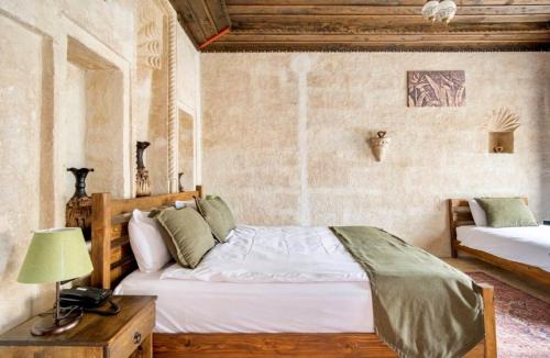 Uzay Cave Suite Hotelにあるベッド