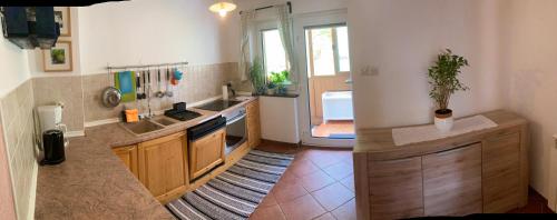 a kitchen with a sink and a counter top at Holiday Home Kristi in Bovec