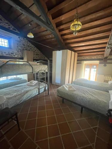 a bedroom with two bunk beds in a room at La canongia in Segovia