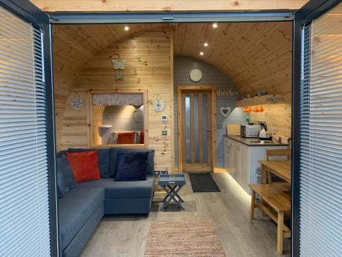 a living room and kitchen in a tiny house at Daviot Luxury Pods in Inverness