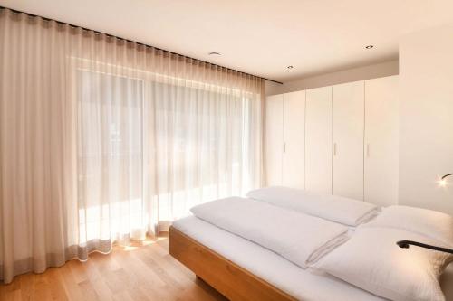 A bed or beds in a room at Apartments Johanna