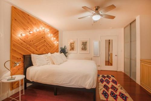 a bedroom with a bed and a ceiling fan at The Creekside Retreat: Steps to all of Telluride in Telluride