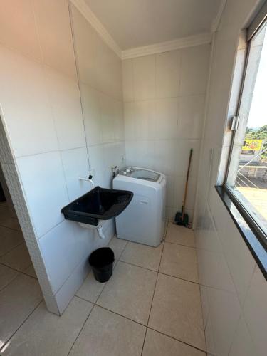 a bathroom with a sink and a toilet at AP inteiro+menor preço+ar condicionado in Goiânia