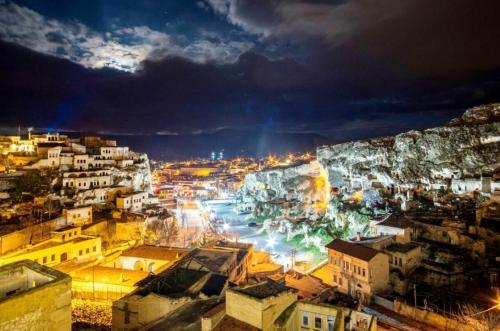a view of a city at night at Uzay Cave Suite Hotel in Ürgüp