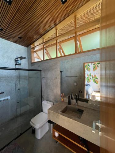 a bathroom with a sink and a toilet and a shower at Verde Mar Pousada in Angra dos Reis